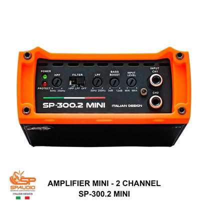 An SP-Spaudio SP-300.2 Mini 2-channel amplifier with a bright orange protective casing and a black front panel featuring various control knobs and input/output jacks.