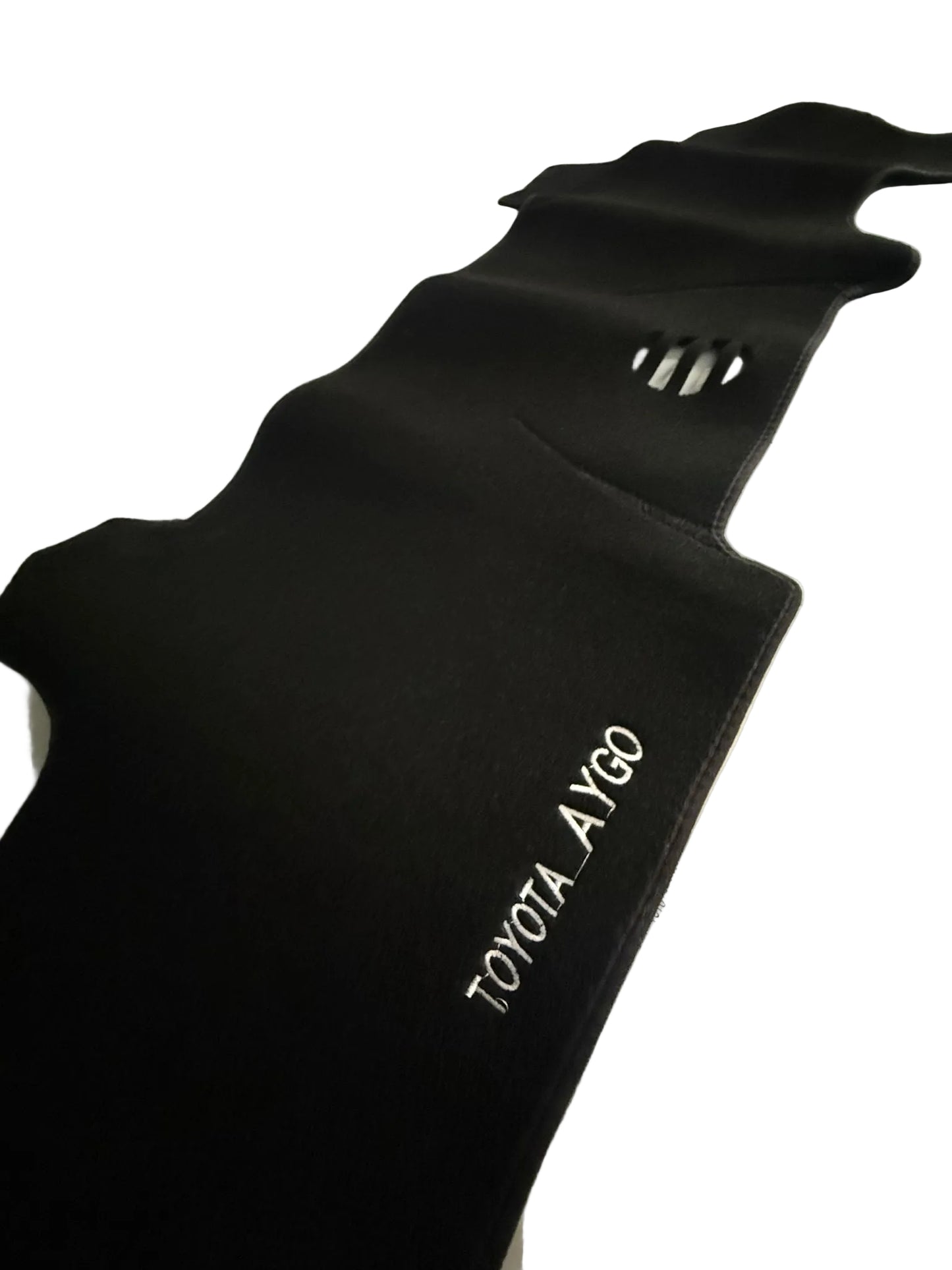 Black car mat with 'TOYOTA AYGO' branding on a white surface.