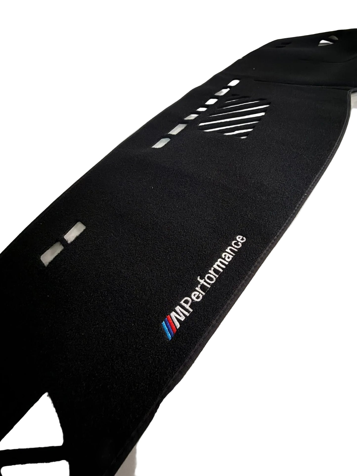 Car mat with M Performance logo on a vehicle interior.