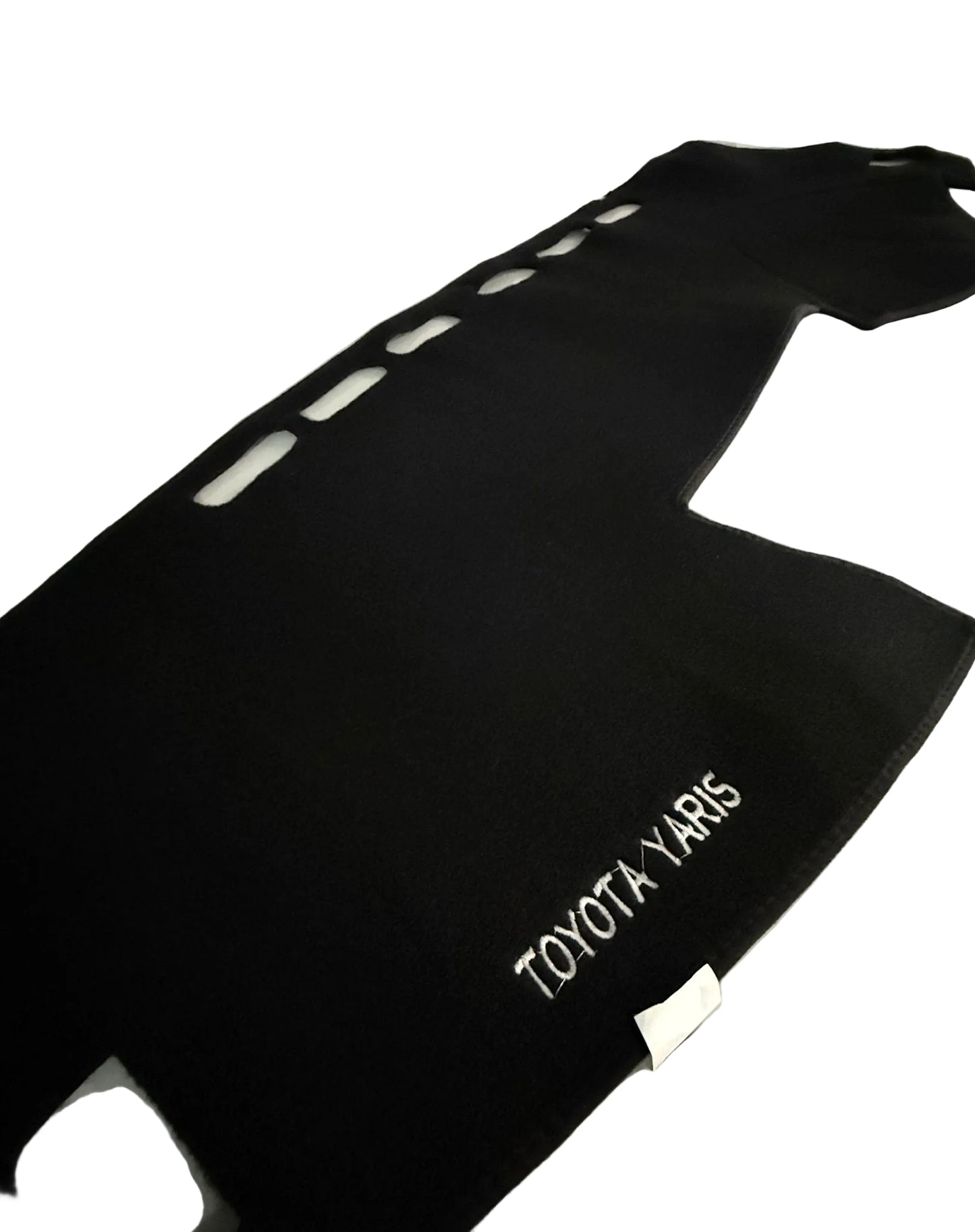 Black car mat with 'TOYOTA YARIS' branding on a white surface.