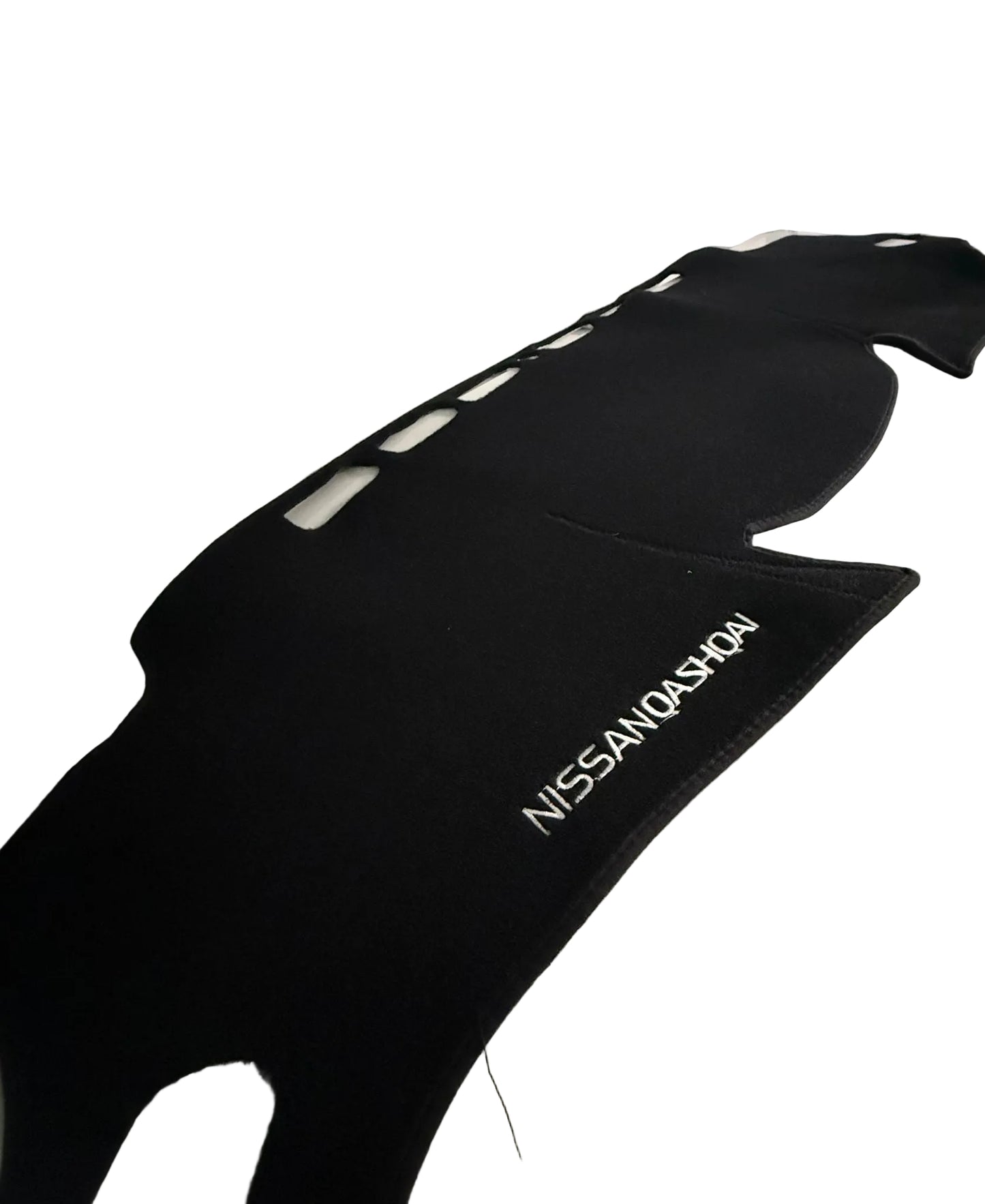Black car mat with 'Nissan Qashqai' branding on a vehicle interior.