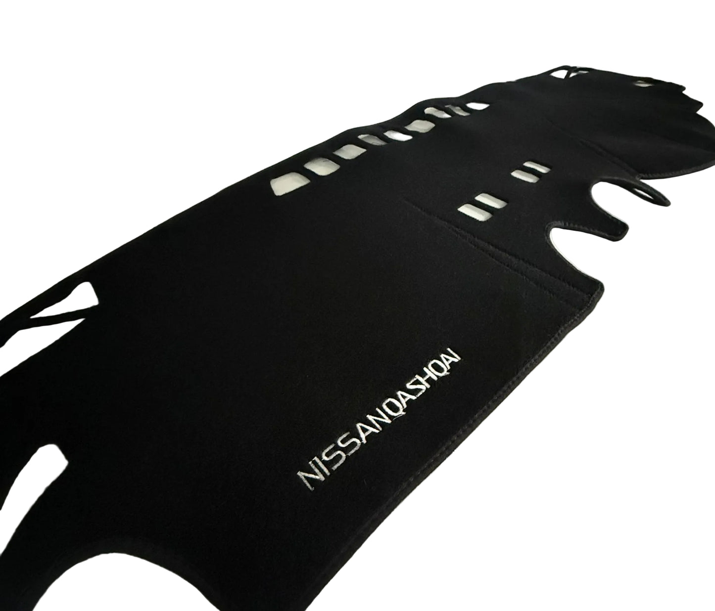 Black car mat with 'Nissan Qashqai' branding on a white surface.