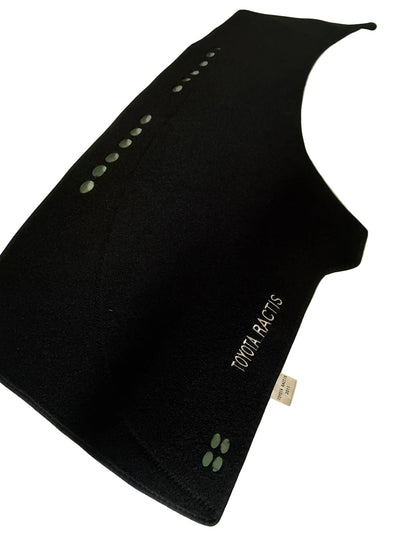Black car mat with 'YOKOHAMA' branding on a light green surface