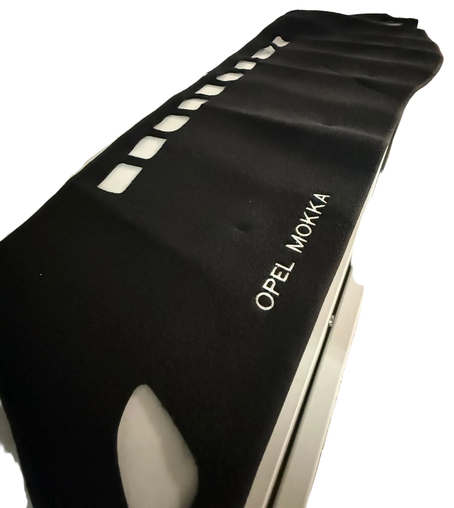 Black car mat with 'Opel Mokka' branding on a white background