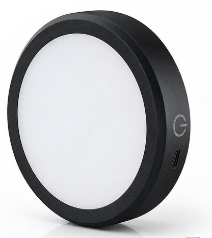 Black circular light with a power symbol on a white background