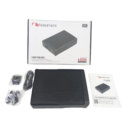 Nakamichi NBF20.0A 650W active speaker enclosure kit, including the black speaker box, original white retail box, power cable, mounting hardware, and user manual on a white background.
