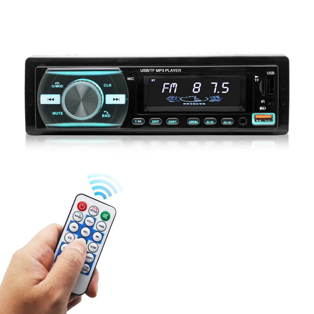 Black car stereo headunit with a digital display and control buttons, shown with a hand holding a matching remote control below on a white background.